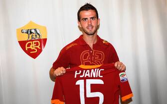 The Bosnian midfielder Miralem Pjanic, new signing AS Roma, the jersey displays the number 15, before the press conference held at the sports center of Trigoria, Rome, today September 9, 2011.  ANSA / ANDREA STACCIOLI