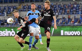 ROME, ITALY - JULY 04: Sergei Milinkovic-Savic of SS Lazio competes for the ball with Alexis Saelemaekers and Simon Kjaer of AC Milan ,during the Serie A match between SS Lazio and AC Milan at Stadio Olimpico on July 4, 2020 in Rome, Italy. (Photo by MB Media/Getty Images)