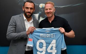 ROME, ITALY - SEPTEMBER 15: SS Lazio new signing Vedat Muriqi poses with SS Lazio sporting director Igli Tare while holding his new jersey at Formello sporting center on September 15, 2020 in Rome, Italy. (Photo by Marco Rosi - SS Lazio/Getty Images)