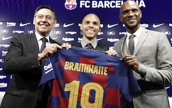 epa08232289 FC Barcelona's president Josep Maria Bartomeu (L) and FC Barcelona's sport director Eric Abidal (R) pose with Danish striker Martin Braithwaite during his presentation as a new FC Barcelona player, in Barcelona, Spain, 20 February 2020. Braithwaite, who joined from CD Leganes, signed a contract with FC Barcelona for the remainder of the season and the following four.  EPA/Andreu Dalmau