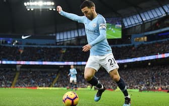 Manchester City's Spanish midfielder David Silva looks to pass the ball during the English Premier League football match between Manchester City and Arsenal at the Etihad Stadium in Manchester, north west England, on February 3, 2019. (Photo by Paul ELLIS / AFP) / RESTRICTED TO EDITORIAL USE. No use with unauthorized audio, video, data, fixture lists, club/league logos or 'live' services. Online in-match use limited to 120 images. An additional 40 images may be used in extra time. No video emulation. Social media in-match use limited to 120 images. An additional 40 images may be used in extra time. No use in betting publications, games or single club/league/player publications. /         (Photo credit should read PAUL ELLIS/AFP via Getty Images)