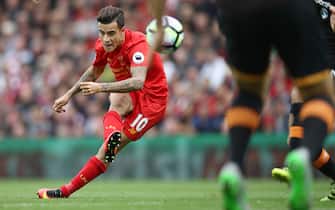 LIVERPOOL, ENGLAND - SEPTEMBER 24:  Philippe Coutinho of Liverpool scores their fourth goal during the Premier League match between Liverpool and Hull City at Anfield on September 24, 2016 in Liverpool, England.  (Photo by Julian Finney/Getty Images)