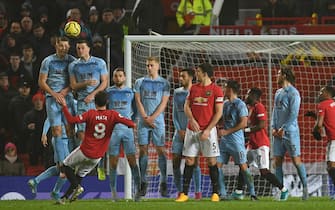 Manchester United's Spanish midfielder Juan Mata (L) takes a freekick during the English Premier League football match between Manchester United and Burnley at Old Trafford in Manchester, north west England, on January 22, 2020. (Photo by Paul ELLIS / AFP) / RESTRICTED TO EDITORIAL USE. No use with unauthorized audio, video, data, fixture lists, club/league logos or 'live' services. Online in-match use limited to 120 images. An additional 40 images may be used in extra time. No video emulation. Social media in-match use limited to 120 images. An additional 40 images may be used in extra time. No use in betting publications, games or single club/league/player publications. /  (Photo by PAUL ELLIS/AFP via Getty Images)