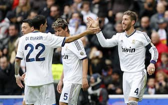 MADRID, SPAIN - JANUARY 27:  Sergio Ramos (R) of Real Madrid celebrates with team-mate Angel di Maria after scoring the opening goal of the La Liga match between Real Madrid an Getafe at Estadio Santiago Bernabeu on January 27, 2013 in Madrid, Spain.  (Photo by Angel Martinez/Real Madrid)