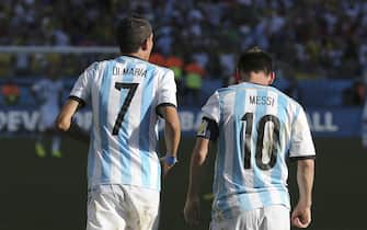 Argentinean midfielder Angel di Maria (L) and Argentinean striker Lionel Messi (R) after his goal against Swiss during the extra time the FIFA World Cup 2014 round of 16 soccer match between Argentina and Switzerland, at Arena de Sao Paulo in Sao Paulo, Brazil, 1 July 2014. EFE/Sebastiao Moreira RESTRICTIONS APPLY: Editorial Use Only, not used in association with any commercial entity - Images must not be used in any form of alert or push service in any kind including via mobile alert services, downloads to mobile devices or MMS messaging - Images must appear as still images and must not emulate match action video footage - No alteration is made to, and no text or image is superimposed over, any published image which: (a) intentionally obscures or removes a sponsor identification image; or (b) adds or overlays the commercial identification of any third party which is not officially associated with the FIFA World Cup)