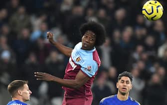 epa08093032 West Ham's Carlos Sanchez (C) heads the ball during the English Premier league soccer match between West Ham United and Leicester City held at the London stadium in London, Britain, 28 December 2019.  EPA/FACUNDO ARRIZABALAGA EDITORIAL USE ONLY. No use with unauthorized audio, video, data, fixture lists, club/league logos or 'live' services. Online in-match use limited to 120 images, no video emulation. No use in betting, games or single club/league/player publications