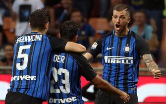 Inter's forward Eder (23) celebrates with his teammates Roberto Gaglairdini (L) and Davide Santon (R) after scoring his goal during the Italian Serie A soccer match between Fc Internazionale and Udinese at Giuseppe Meazza stadium in Milan, Italy, 28 May 2017. ANSA / MATTEO BAZZI
