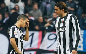 Juventus' Sebastian Giovinco (L) reacts next to teammate Andrea Matri during the Italian serie A football match between Juventus and Sampdoria, at the Juventus Stadium in Turin, on January 6, 2013. AFP PHOTO / FABIO MUZZI (Photo by FABIO MUZZI / AFP)        (Photo credit should read FABIO MUZZI/AFP via Getty Images)