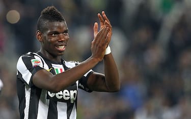 TURIN, ITALY - SEPTEMBER 22:  Paul Pogba of FC Juventus salutes the crowd at the end of the Serie A match between FC Juventus v AC Chievo Verona at Juventus Arena on September 22, 2012 in Turin, Italy.  (Photo by Marco Luzzani/Getty Images)