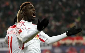 epa06577703 Leipzig's Jean-Kevin Augustin celebrates his goal against Dortmund during the German Bundesliga soccer match between RB Leipzig and Borussia Dortmund, in Leipzig, Germany, 03 March 2018.  EPA/FELIPE TRUEBA (EMBARGO CONDITIONS - ATTENTION: Due to the accreditation guidelines, the DFL only permits the publication and utilisation of up to 15 pictures per match on the internet and in online media during the match.)
