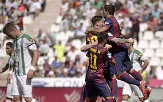 FC Barcelona's Argentinian striker Lionel Messi (2L) jubilates a goal against Cordoba during their Primera Division soccer match played at Nuevo Arcangel stadium in Cordoba, Andalusia, Spain on 02 May 2015. EFE/Salas