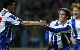 PORTO, PORTUGAL:  Porto's Ricardo Carvalho (R) and Paulo Ferreira (L) celebrate after scoring their second goal during their Champions League quarter-final first leg football match at Do Dragao stadium in Porto. 23 March, 2004. AFP PHOTO/ Javier SORIANO.  (Photo credit should read JAVIER SORIANO/AFP via Getty Images)