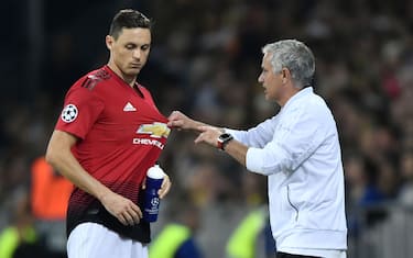 Manchester United's Portuguese manager Jose Mourinho (R) gestures as he speaks with Manchester United's Serbian midfielder Nemanja Matic during the UEFA Champions League group H football match between Young Boys and Manchester United at The Stade de Suisse in Bern on September 19, 2018. (Photo by Fabrice COFFRINI / AFP)        (Photo credit should read FABRICE COFFRINI/AFP via Getty Images)