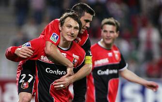 RENNES, FRANCE:  (from L) Rennes midfielder Kim Kallstrom of Sweden, midfielder Cyril Jeunechamp and forward Alexander Frei of Swiss jubilate after the French L1 football match Rennes-Strasbourg, 21 May 2005 at the "Route de Lorient" stadium in Rennes. Rennes won 4-0.  AFP PHOTO VALERY HACHE  (Photo credit should read VALERY HACHE/AFP via Getty Images)