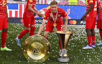 SALZBURG, AUSTRIA - MAY 21: Ignace Van der Brempt of Salzburg with Championship trophy and the Austrian Soccer Cup during the Admiral Bundesliga match between FC Red Bull Salzburg and SK Austria Klagenfurt at Red Bull Arena on May 21, 2022 in Salzburg, Austria. (Photo by Hans Peter Lottermoser/SEPA.Media /Getty Images)