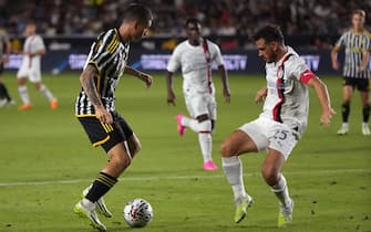epa10772635 Alessandro Florenzi (R) of AC Milan gets defensive against Matias Soule (L) of Juventus during the second half of the 2023 Soccer Champions Tour soccer match between Juventus and AC Milan at Dignity Health Sports Park in Carson, California, USA, 27 July 2023.  EPA/ALLISON DINNER