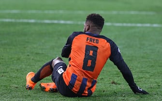 KHARKIV, UKRAINE - FEBRUARY 21, 2018: Fred of Shakhtar Donetsk seats on the grass during UEFA Champions League Round of 16 game against AS Roma at OSK