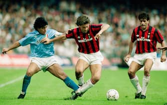 NAPLES, ITALY - OCTOBER 21: Napoli player Diego Maradona (l) challenges Carlo Ancelotti of AC Milan during an Italian League match on October 21, 1990 in Naples, Italy. (Photo by Simon Bruty/Allsport/Getty Images)