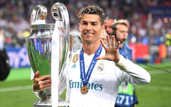KIEV, UKRAINE - MAY 26:  Cristiano Ronaldo of Real Madrid lifts The UEFA Champions League trophy following his sides victory in during the UEFA Champions League Final between Real Madrid and Liverpool at NSC Olimpiyskiy Stadium on May 26, 2018 in Kiev, Ukraine.  (Photo by Laurence Griffiths/Getty Images)