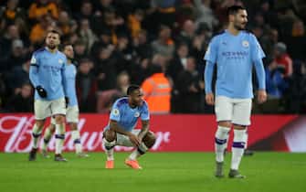 WOLVERHAMPTON, ENGLAND - DECEMBER 27: Raheem Sterling of Manchester City among dejected teammates after the 2nd Wolves goal during the Premier League match between Wolverhampton Wanderers and Manchester City at Molineux on December 27, 2019 in Wolverhampton, United Kingdom. (Photo by Marc Atkins/Getty Images)