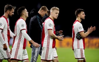 epa08061231 Ajax players react after the UEFA Champions League Group H soccer match between Ajax and Valencia in Amsterdam, The Netherlands, 10 December 2019.  EPA/OLAF KRAAK