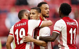 epa08684263 (L-R) Zakaria Labyad of Ajax, Antony Matheus Dos Santos of Ajax, Noussair Mazraoui or Ajax, Quincy Promes or Ajax celebrate the 2-0 goal during the Dutch Eredivisie soccer match between Ajax Amsterdam and RKC Waalwijk at the Johan Cruijff Arena in Amsterdam, The Netherlands, 20 September 2020.  EPA/MAURICE VAN STEEN