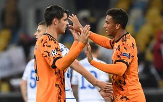 Juventus' Spanish forward Alvaro Morata celebrates with a teammate after the UEFA Champions League group G football match between FC Dynamo Kiev and Juventus at the Olympiyskiy stadium in Kiev on October 20, 2020. (Photo by Sergei SUPINSKY / AFP) (Photo by SERGEI SUPINSKY/AFP via Getty Images)