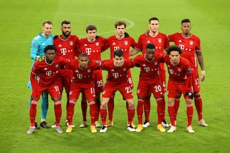 MUNICH, GERMANY - DECEMBER 09: The Bayern Munich players Alphonso Davies (first row, L-R), Douglas Costa, Marc Roca, Bouna Sarr, Leroy Sane, Manuel Neuer (second row, L-R), Eric Maxim Choupo-Moting, Thomas Mueller, Leon Goretzka, Niklas Suele and Jerome Boateng pose for a photo ahead of the UEFA Champions League Group A stage match between FC Bayern Muenchen and Lokomotiv Moskva at Allianz Arena on December 09, 2020 in Munich, Germany. Sporting stadiums around Germany remain under strict restrictions due to the Coronavirus Pandemic as Government social distancing laws prohibit fans inside venues resulting in games being played behind closed doors. (Photo by Alexander Hassenstein/Getty Images)