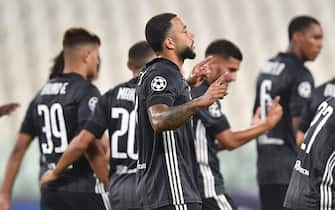 Lyon’s Memphis Depay jubilates after scoring the goal (0-1) during the UEFA Champions League round of 16 second leg soccer match Juventus FC vs Olympique Lyon at the Allianz Stadium in Turin, Italy, 07 August 2020.ANSA/ALESSANDRO DI MARCO