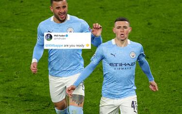 epa09135895 Manchester City's Phil Foden (R) celebrates after scoring the 2-1 with Manchester City's Kyle Walker during the UEFA Champions League quarter final, second leg soccer match between Borussia Dortmund and Manchester City in Dortmund, Germany, 14 April 2021.  EPA/FRIEDEMANN VOGEL / POOL
