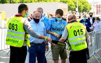 PORTO, PORTUGAL - MAY 29: Fans are checked by security as they enter the Manchester City fan zone prior to the UEFA Champions League Final between Manchester City and Chelsea FC at Estadio do Dragao on May 29, 2021 in Porto, Portugal. (Photo by Manchester City FC/Manchester City FC via Getty Images)