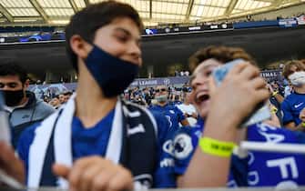 Chelsea supporters wait for the start of the UEFA Champions League final football match between Manchester City and Chelsea at the Dragao stadium in Porto on May 29, 2021. (Photo by PIERRE-PHILIPPE MARCOU / POOL / AFP) (Photo by PIERRE-PHILIPPE MARCOU/POOL/AFP via Getty Images)