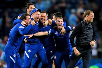 epa09235960 Chelsea's manager Thomas Tuchel (R) and his staff celebrate after winning the UEFA Champions League final between Manchester City and Chelsea FC in Porto, Portugal, 29 May 2021.  EPA/David Ramos / POOL