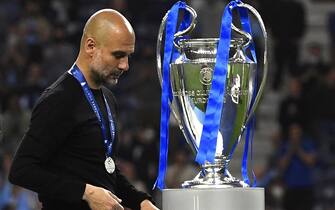 epa09235994 Manchester City manager Pep Guardiola reacts after the UEFA Champions League final between Manchester City and Chelsea FC in Porto, Portugal, 29 May 2021.  EPA/Pierre-Philippe Marcou / POOL