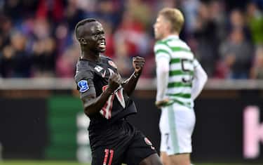 epa09374860 Awer Mabil of Midtjylland celebrates after scoring the 1-1 equalizer during the UEFA Champions League second qualifying round, second leg soccer match between FC Midtjylland and Celtic Glasgow in Herning, Denmark, 28 July 2021.  EPA/Bo Amstrup  DENMARK OUT
