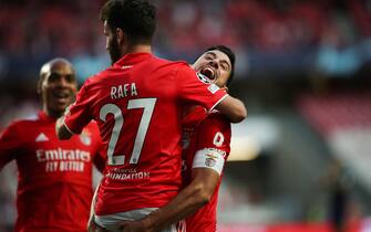 epa09419493 Benfica's Rafa (C) celebrates with Pizzi (R) after scoring a goal during the UEFA Champions League play-off first leg soccer match against PSV Eindhoven at Luz Stadium, in Lisbon, Portugal, 18 August 2021.  EPA/MARIO CRUZ