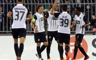 epa09497933 Partizan's Lazar Markovic (2-L) celebrates with teammates after scoring the 1-0 lead during the UEFA Europa Conference League soccer match between Partizan Belgrade and FC Flora Tallinn in Belgrade, Serbia, 30 September 2021.  EPA/ANDREJ CUKIC