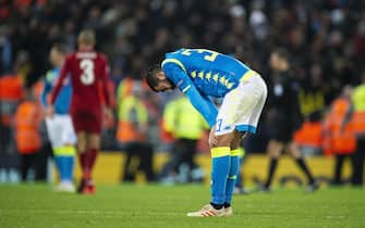epa07224748 Napoli's Raul Albiol reacts after the UEFA Champions League Group C soccer match between Liverpool FC and SSC Napoli held at the Anfield in Liverpool, Britain, 11 December 2018.  EPA/PETER POWELL .