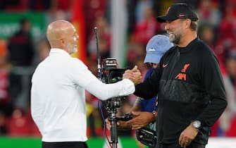 AC Milan manager Stefano Pioli greets Liverpool manager Jurgen Klopp during the UEFA Champions League, Group B match at Anfield, Liverpool. Picture date: Wednesday September 15, 2021.