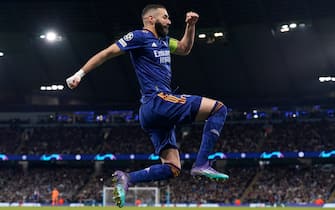 Manchester, England, 26th April 2022.  Karim Benzema of Real Madrid celebrates scoring their third goal from the penalty spot during the UEFA Champions League match at the Etihad Stadium, Manchester. Picture credit should read: Andrew Yates / Sportimage via PA Images