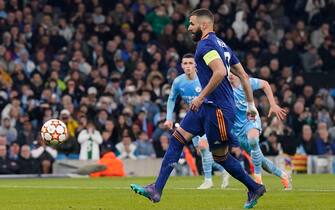 Manchester, England, 26th April 2022.  Karim Benzema of Real Madrid scores their third goal from the penalty spot during the UEFA Champions League match at the Etihad Stadium, Manchester. Picture credit should read: Andrew Yates / Sportimage via PA Images