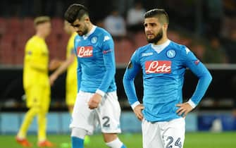 Napoli's Lorenzo Insigne, right, and Elseid Hysaj leave the pitch disappointed at the end of the UEFA Europa League soccer match between SSC Napoli and Villarreal CF at the San Paolo stadium, Naples, Italy, 25 February 2016. ANSA /  CIRO FUSCO

