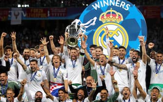 epa06765845 Real Madrid captain Sergio Ramos lifts the trophy after the won the UEFA Champions League final between Real Madrid and Liverpool FC at the NSC Olimpiyskiy stadium in Kiev, Ukraine, 26 May 2018. Madrid won 3-1.  EPA/ARMANDO BABANI