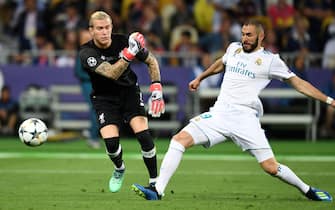 KIEV, UKRAINE - MAY 26: Karim Benzema of Real Madrid scores the opening goal by intercepting the ball thrown by Loris Karius of Liverpool during the UEFA Champions League final between Real Madrid and Liverpool at NSC Olimpiyskiy Stadium on May 26, 2018 in Kiev, Ukraine. (Photo by Etsuo Hara/Getty Images)