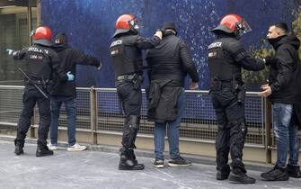 epa10527392 Ertzaintza Police officers check supporters ahead of the UEFA Europa League round of 16 second leg soccer match between Real Sociedad and AS Roma, in San Sebastian, northern Spain, 16 March 2023.  EPA/Javier Etxezarreta