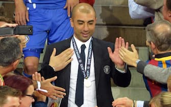 Chelsea's head coach Roberto Di Matteo (C) is congratulated after the UEFA Champions League soccer final between FC Bayern Munich and Chelsea FC in Munich, Germany, 19 May 2012.
ANSA/MARCUS BRANDT