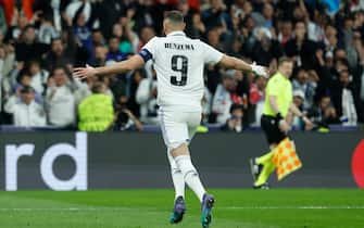 epa10525171 Real Madrid's Karim Benzema celebrates after scoring the 1-0 lead during the UEFA Champions League round of 16 second leg soccer match between Real Madrid and Liverpool, in Madrid, Spain, 15 March 2023.  EPA/JUANJO MARTIN