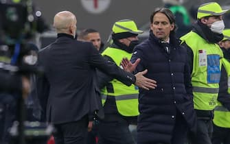 FC Inter's coach Simone Inzaghi and AC Milan's coach Stefano Pioli at the end of the Italian Cup semi-final soccer match between AC Milan and FC Inter at Giuseppe Meazza Stadium in Milan, Italy, 1 March 2022. ANSA / ROBERTO BREGANI