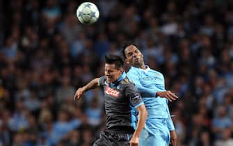 Manchester City's Joleon Lescott (R) vies for the ball with Napoli's Marek Hamsik (L) during the UEFA Champions League soccer match between Manchester City and SSC Napoli in Manchester, Britain, 14 September 2011. ANSA/ROBIN PARKER