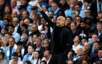 epa10634917 Manchester City head coach Pep Guardiola gestures during the UEFA Champions League semi-finals, 2nd leg soccer match between Manchester City and Real Madrid in Manchester, Britain, 17 May 2023.  EPA/ADAM VAUGHAN